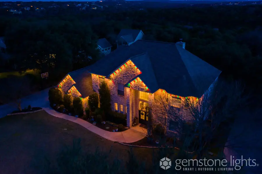 House lit up with permanent Gemstone Lights at twilight